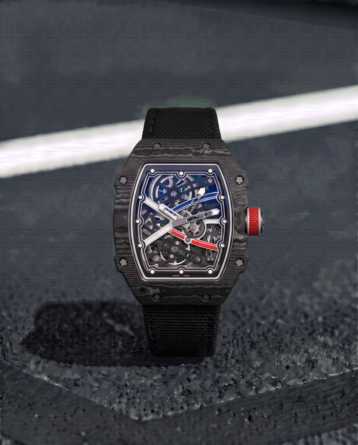 Skeleton luxury men's watch with black carbon fiber case and red accent crown
